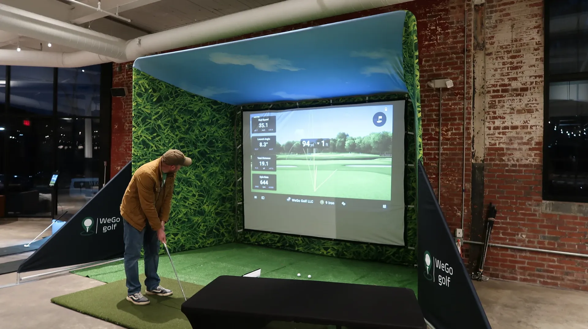 Colleagues competing at a WeGo Golf corporate event activation